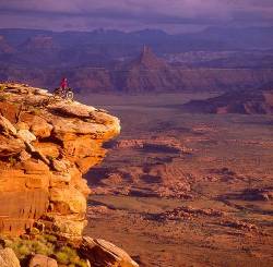Girl Mt Biking At Needles Overlook In Canyonlands , Utah USA