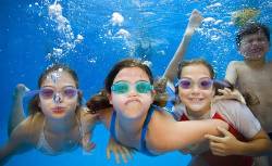 Children Swimming Underwater