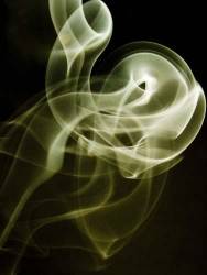 Smoke Making Patterns Against A Black Background
