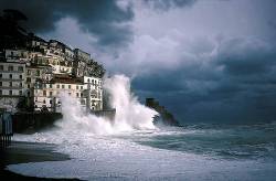 Large Waves Crashing Against Shore And Houses During Storm Amalfi Italy