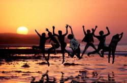 Jumping At The Beach At Sunset