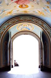 Old Woman Sitting Behind Open Cathedral Gates Leading Into The Light Christian Religious Paintings Inside The Gate House Heavens Gate Concept Kiev Ukraine Eastern Europe Archangel Michael Cathedral Entrance