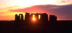 Stonehenge With Setting Sun Flaring Through Stone Arch