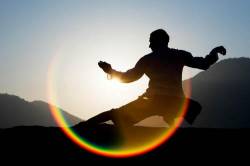 Tai Chi Silhouette At Sunrise With Lens Flare