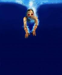 Girl Wearing Swim Goggles Diving Into The Ocean