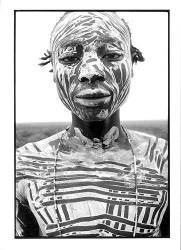 Black And White Close Up Portrait Of The Painted Face And Torso Of A Young Karo Man . Jinka Region . Ethiopia