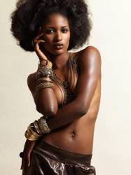 High Fashion Photo Of A Young Beautiful Woman Wearing Jewelry Posing On Beige Background