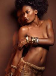 High Fashion Photo Of A Young Beautiful Woman Wearing Jewelry Posing On Brown Background