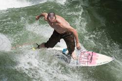 River Surfing At Englischer Garten In Munich , Germany .