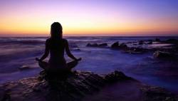Young Woman Meditating After Sunset Greece