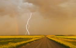 Storm , Gravel Road Between Farmland , Near Val Marie , Saskatchewan