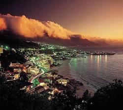 A Night Scene Clifton Set Against The Backdrop Of Orange Tinted Clouds Rolling Off The Mountains , Cape Town , Western Cape , South Africa