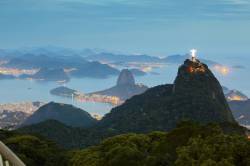 Christ , The Redeemer Statue , Rio De Janeiro , Brazil . Sugar Loaf Mountain In The Background . Brazil Landmarks .
