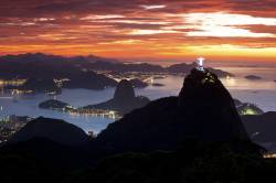 Christ , The Redeemer Statue , Rio De Janeiro , Brazil . Sugar Loaf Mountain In The Background . Brazil Landmarks .