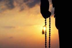 Hand With Japamala Beads Silhouette Landscape