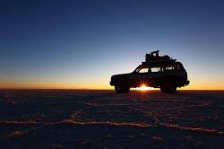 Toyota Land Cruiser Silhouetted Against Sunrise , Salar De Uyuni , Bolivia