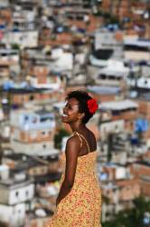 Beautiful Black Young Woman At Complexo Do AlemÃ£o , Rio De Janeiro Favela , Brazil . Since 2012 The Area Has Operations Of The Pacifying Police Unit ( Unidade De PolÃ­cia Pacificadora , Also Translated As Police Pacification Unit ) , Abbreviated UPP , A Law Enforcement And Social Services Program Which Aims At Reclaiming Territories , More Commonly Favelas , Controlled By Gangs Of Drug Dealers .