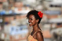 Beautiful Black Young Woman At Complexo Do AlemÃ£o , Rio De Janeiro Favela , Brazil . Since 2012 The Area Has Operations Of The Pacifying Police Unit ( Unidade De PolÃ­cia Pacificadora , Also Translated As Police Pacification Unit ) , Abbreviated UPP , A Law Enforcement And Social Services Program Which Aims At Reclaiming Territories , More Commonly Favelas , Controlled By Gangs Of Drug Dealers .