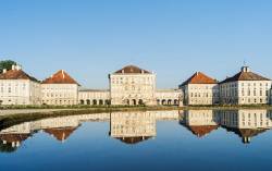 Nymphenburg Palace And Park In Munich . Eastern Facade During Morning . Nymphenburg Palace , With Its Park , Gardens And Channels Is One Of The Main Tourist Attractions In Munich , Bavaria , Germany . It Was Commisioned By Prince Elector ( Kurfuerst ) Ferdinand Maria In 1664 , Altered And Expanded During The Following Centuries . For A Long Time It Was The Summer Residence For The Bavarian Kings Of The House Of Wittelsbach Nymphenburg Park And Its Gardens Ist Considered To Be One Of The Most Importent Examples Of Garden Architecture In Germany And Europe . The Park Is Open To The Public Free Of Charge And Is Very Popular With Runners , Walkers And Families . Europe , Central Europe , Germany , Bavaria , Munich , August 2013