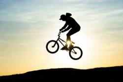 Young Man Jumping On Bmx Bike Silhouette Landscape