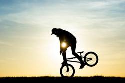 Young Man Silhouette On Bmx Bike Doing Tricks