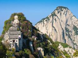 The Northern Peak Of Mount Huashan China , Asia . Mount Huashan Is Located In The Shaanxi Province Of China About 120km East From The City Of Xian . The Mountain Is Regarded As The Holy Mountain And One Of Chinas Five Great Mountains . The Summit Contains Five Peaks With The Northern Peak ( Pictured On The Left Of Image ) The Lowest At An Altitude Of Around 1600m , The Highest Peak Is Around 2100m . The Mountain Contains Temples And Religious Structures And Now Some Basic Hotels As It Accommodates The Thousands Of Visitors A Year Who Climb The Mountain .