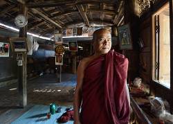 Monk In His Monastery Living Quarters In The Village Of Salay , South Of Bagan , Myanmar ( Burma ) . Salay Is An Important Religious Centre With Approx 50 Monasteries And Many Buddhist Temples .