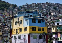 The Rocinha Favela , One Of The Largest In Rio De Janeiro , Brazil . These Urban Shantytowns Are Typically Unregulated And Without Proper Sewer Or Electrical Infrastructure .