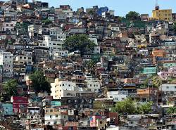 The Rocinha Favela , One Of The Largest In Rio De Janeiro , Brazil . These Urban Shantytowns Are Typically Unregulated And Without Proper Sewer Or Electrical Infrastructure . Housing A Large Segment Of The Population , They Often Exist Adjacent To Very Affluent Neighborhoods Of The City .