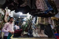 Vendor At Bazaar Shop Selling Military Gear At Dohuk Bazaar, Kurdish Iraq
