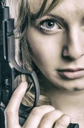Woman Holding A Gun