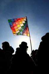 Aymara People Holding Wiphala Flag At Sunrise During Aymara New Year / June 21st Winter Solstice Celebrations , Tiwanaku , Bolivia