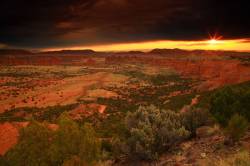 Sunrise Under Storm Clouds Over The Monuments Of Upper Cathedral Valley In Capital Reef National Park In Utah