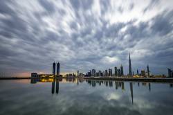Dubai DesignDistrict And Dubai Downtown During Cloudy Sunset