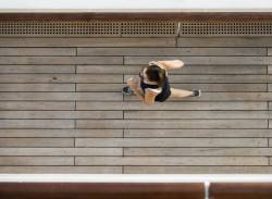 Woman Jogging On The Deck Of A Cruise Ship.