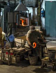 Glassmith Working, Venetian Island Of Murano, Italy. Famous For It’s Many Furnaces And Hand Made Glass.