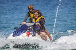 A Teenage Filipino Boy Learns How To Drive A Water Jet Ski At White Beach, Puerto Galera, Oriental Mindoro Island, Philippines.