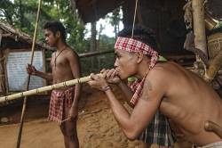 A Palawano Teenage Boy Demonstrates The Use Of A Bamboo Blowgun At The Palawan Eco Garden And Tribal Village In Puerto Princesa, Palawan Island, Philippines. Palawano Or Pala’wan Are An Indigenous Ethnic Group Native To The Island Of Palawan And Were One Of The First Tribes To Settle In The Philippines.