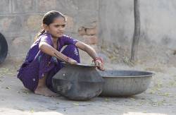 Young Girl Preparing Food In Chanoud , Rajasthan , India .