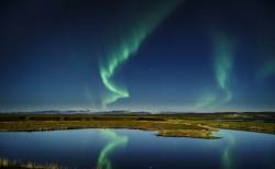 Northern Lights With Moonlight Over The Skafta River, Near Kirkjubaejarklaustur Village, Iceland