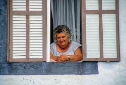 Portrait Of A Matronly Azorian Portuguese Woman Gazing Serenely As She Leans Out Her Home Window On Pico Island, Azores. 35mm Slide Scan Best Used At Lower Res. Digital Scan Available.