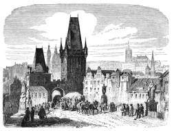 A View Of One Of The Bridge Towers Of The Charles Bridge In Over The Vltava River In  Prague, The Capital And Largest City Of The Czech Republic.