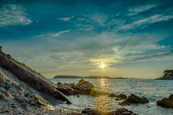 Sunset Over Rocky Beach