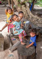 Foiur Young Cambodian Khmer Children Share A Snack Together In Banteay Srei Near Siem Reap, Kingdom Of Cambodia.