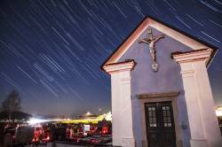Star Trails Behind A Small Chapel In Vodice, Gorenjska, Slovenia. The Brightest Stars Around The Church Spire Are From The Orion Constellation. This Small Graveyard Is Also Lit By Candles On The Graves, Which Is A Common Practice Here In Slovenia. This Image Was Captured Just As The Moon Was Waning At 96.4% And Just Rising To The East, Which, Along With Cars And Streetlights, Helped To Nicely Illuminate The Chapel And Graveyard.