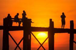 Sunset At Amarapura’s U Bein Bridge Over The Irrawaddy River Near Mandalay - Myanmar