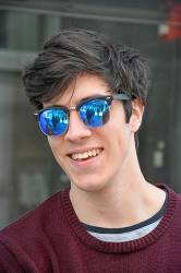 Smiling Teenager With Blue-tinted Sunglasses