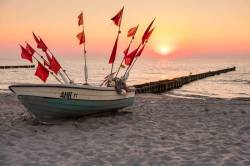 Fishing Boat On The Beach At Sunset At Ahrenshoop, Mecklenburg-Vorpommern, Germany