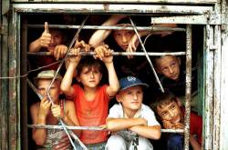 Chechen Kids Watch Circus From Wreckage Of Government Building