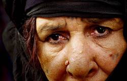 An Iraqi Woman , Accused Of Harboring Her Baathist Bomb Making Son , Watches As Coalition Members Threaten To Flatten Her House With A Bulldozer ( USAF Photo By Staff Sergeant Jeffrey A Wolfe ) RELEASED
